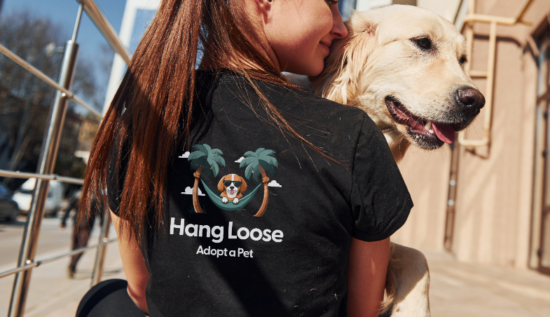 woman sitting down holding a labrador dog